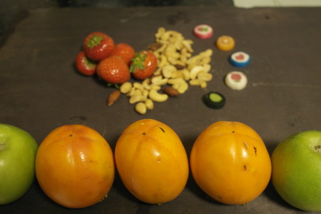 Autumn fruits with cashevs nuts and some sweetsの写真素材