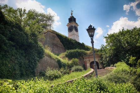 The view on the old clock tower on the Petrovaradin fortress in Novi Sad, Serbiaのeditorial素材
