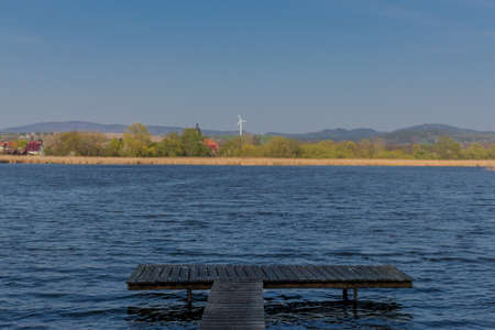 catch the first rays of sunshine at Breitungen lake in the beautiful werratal valleyの写真素材