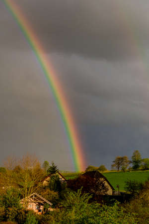 Beautiful rainbow over the roofs of the town of Schmalkalden - Thuringia - Germanyの写真素材
