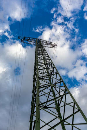 Electric pylon under a cloudy sky
