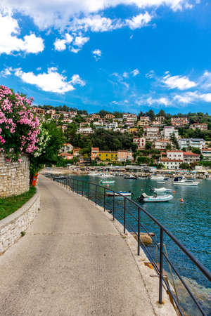 Summer beach walk in the port town of Rabac - Istria - Croatiaの写真素材