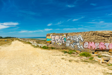 Beach walk on the beautiful Gold Beach off the coast of Ver-sur-Mer - Normandy - Franceのeditorial素材