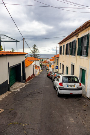 On the road in the romantic port city of Funchal on the Azores island of Madeiraの写真素材