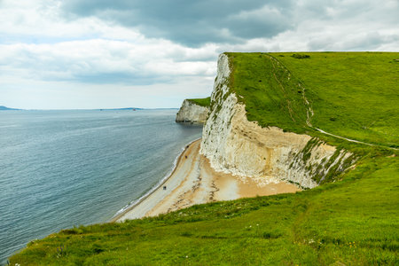 Travelling on the South West Coast Path between Lulworth Cove and Durdle Door near Lulworth - United...
