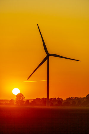 Sunset on the coast with a view of a few wind turbines - Mecklenburg Vorpommern - Germanyの写真素材