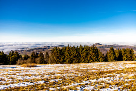Short winter hike on a sunny day around the Wasserkuppe in the beautiful RhÃ¶n - Hesse - Germanyの写真素材