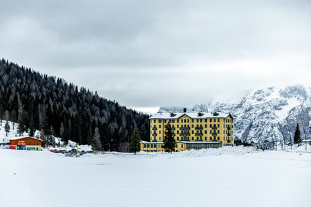 Hike around the snow-covered Lago di Misurina at the gates of the Three Peaks Nature Park - Italyの写真素材
