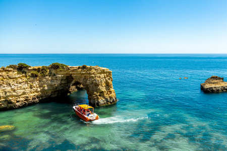 A short visit to the beach in Marinha Bay off the beautiful coast of the Algarve - Portugalの写真素材