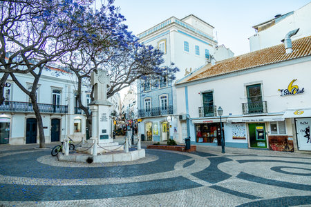 Evening stroll through the coastal town of Lagos in front of the beautiful coastline of the Algarve - Portugalの写真素材