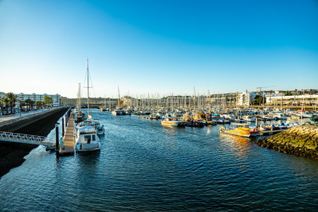 Evening stroll through the coastal town of Lagos in front of the beautiful coastline of the Algarve - Portugalの写真素材