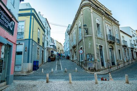 Evening stroll through the coastal town of Lagos in front of the beautiful coastline of the Algarve - Portugalの写真素材
