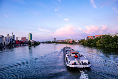 Evening stroll through the Main metropolis of Frankfurt am Main and its beautiful harbor promenade -...