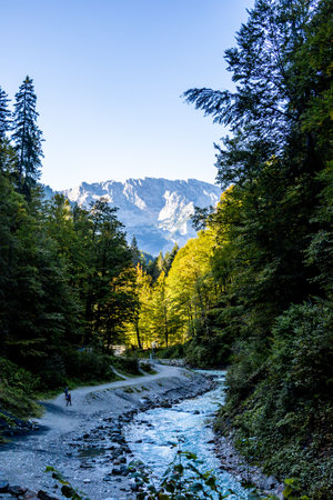 Mountain hike through the beautiful Bavarian Alps just outside Garmisch-Partenkirchen up to the Zugspitze - Bavaria - Germanyの写真素材