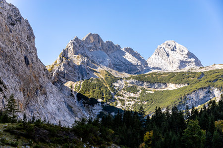 Mountain hike through the beautiful Bavarian Alps just outside Garmisch-Partenkirchen up to the Zugspitze - Bavaria - Germanyの写真素材