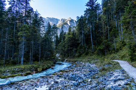 Mountain hike through the beautiful Bavarian Alps just outside Garmisch-Partenkirchen up to the Zugspitze - Bavaria - Germanyの写真素材