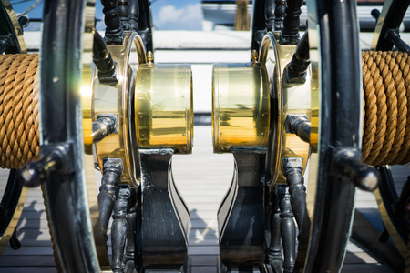 A brass steering wheel of a ship at Portsmouth.の写真素材