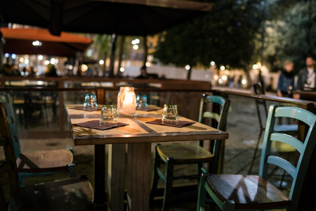 A candle lit table at a bar in Florence.の写真素材