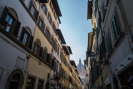 Looking down a street in Florence with cathedral visible.の写真素材