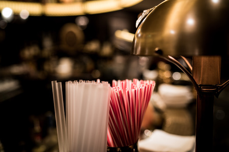 A bunch of straws at a hotel bar.の写真素材