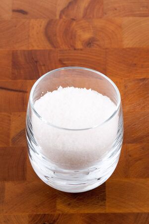 fleur de sel, white sea salt crystals in glassの写真素材