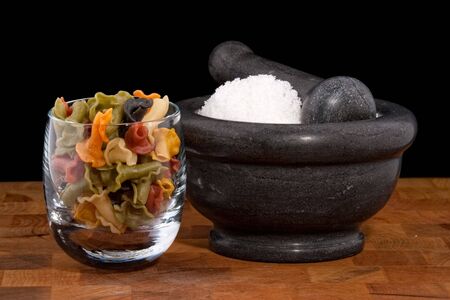 Mortar and pestle with salt, fleur de sel and noodlesの写真素材