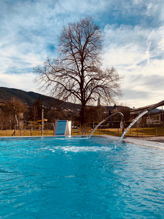Outdoor pool with mountain views in the Italian city of Bressanone blue warm waterのeditorial素材