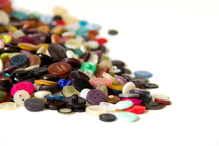 A handful of vintage buttons are on a white background.