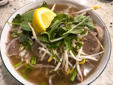 pho,vietnamese beef noodle soup in a Vietnamese restaurant