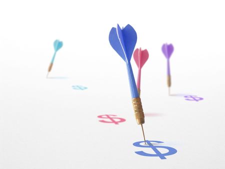 4 darts and dollars on a white background symbol of success in marketing, communication and business.の写真素材