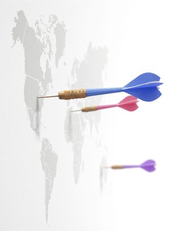 4 darts on a world map symbol of global business around the planetの写真素材