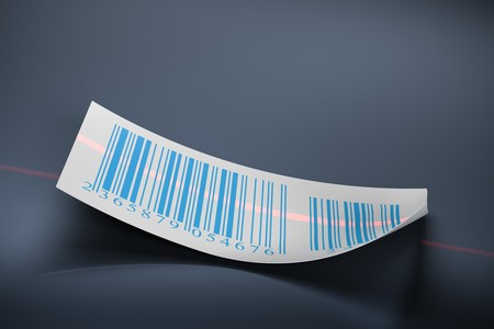 barcodes stickers and laser beam over a dark blue backgroundの写真素材