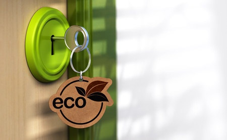 Close up of a door and a key ring where it's written the word eco, the lock is green there is a copy space on the rightの写真素材