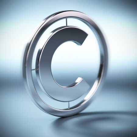 metal copyright symbol onto a blue background square image with blurの写真素材