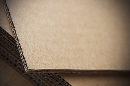 brown corrugated cardboard sheet close up with blur effectの写真素材