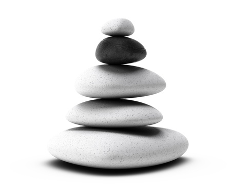 stones pyramid with four white pebbles plus one black pebble over white backgroundの写真素材