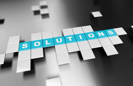 Word Solutions written on blue square blocks over black background with light effectの写真素材