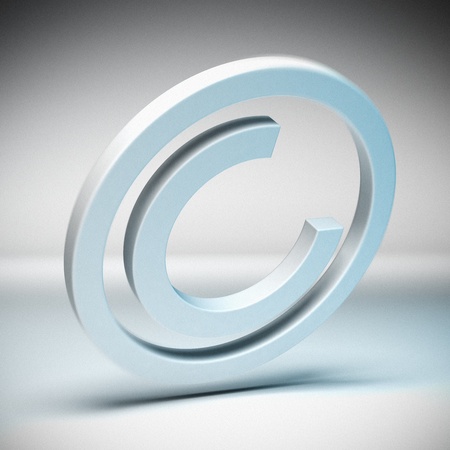 Copyright symbol with blur effect over a grey bakgroundの写真素材