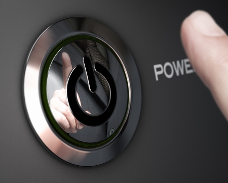 Hand of a businessman reflection in a power button, Image with depth of field and focus on the button の写真素材