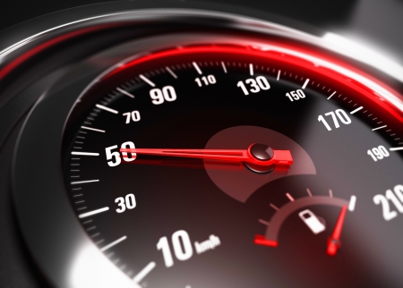 Close up of a car speedometer with the needle pointing 50 Km h, blur effect, conceptual image for safe driving conceptの写真素材