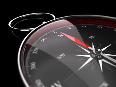 Close up of a compass with needle pointing the north, image over black background decorative element for the bottom right of a page  Concept for advice or assistance の写真素材