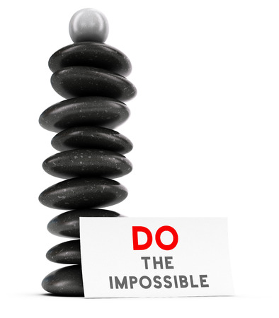 Nine pebbles plus a spherical stone stacked over white background with a label where it is written do the impossible, balancing stones and motivational quote. 3D render symbol of will power and achieving goal.の写真素材