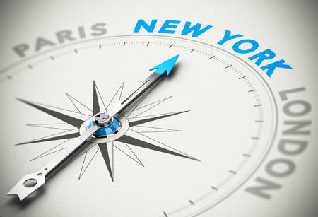 Needle of a compass pointing the word New York with blur effect and paper backgroundの写真素材