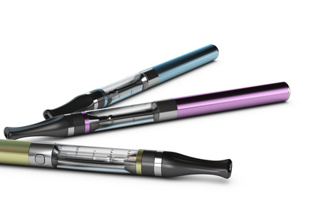 Three ecigarettes over white background with e-liquid inside the container の写真素材