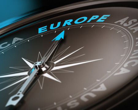 Abstract compass needle pointing the destination europe, blue and brown tones with focus on the main word. Concept image suitable for illustration of trip counseling.の写真素材