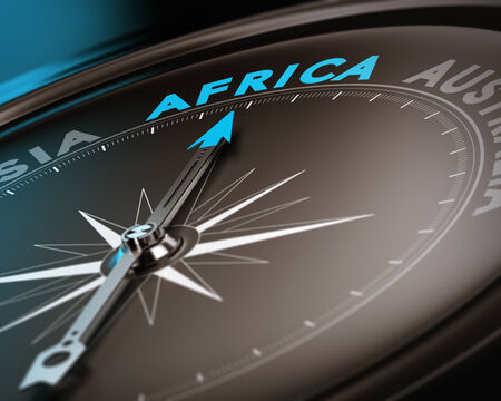 Abstract compass needle pointing the destination africa, blue and brown tones with focus on the main word  Concept image suitable for illustration of trip counseling の写真素材