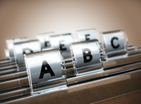 Folder tab organized alphabetically with focus on the A, beige background. Business concept image for illustration of customer data management or address list.の写真素材