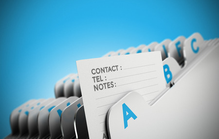 Folder tab organized alphabetically with focus on a contact note, blue background. Conceptual business image for illustration of customer file, client data management or address list.の写真素材