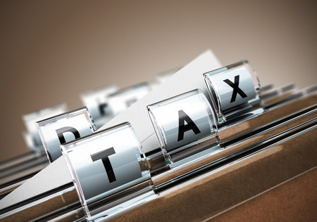 Folder tab with the word tax, beige background  Taxes concept for illustration of taxation の写真素材