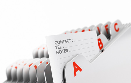 Customer file organized alphabetically with focus on a contact note, white background. Conceptual business image for illustration of clients base, or prospect list.の写真素材